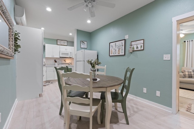 dining area featuring light hardwood / wood-style floors and ceiling fan