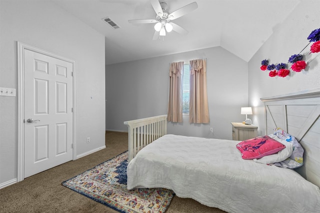 carpeted bedroom with lofted ceiling, baseboards, visible vents, and a ceiling fan