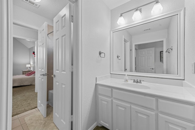 full bathroom featuring ensuite bath, vanity, visible vents, and tile patterned floors