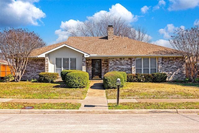 ranch-style house with a front lawn