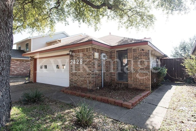 single story home featuring a garage