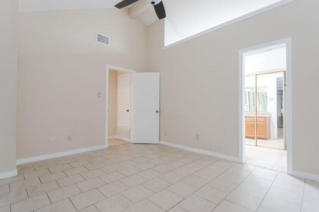 tiled empty room featuring beamed ceiling, high vaulted ceiling, and ceiling fan