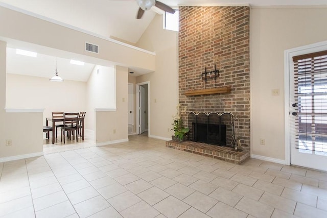 unfurnished living room with light tile patterned flooring, high vaulted ceiling, a brick fireplace, ceiling fan, and beam ceiling