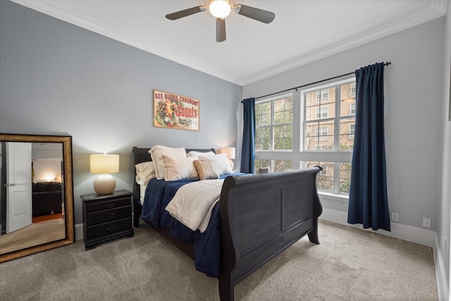 bedroom with ceiling fan, ornamental molding, and light carpet