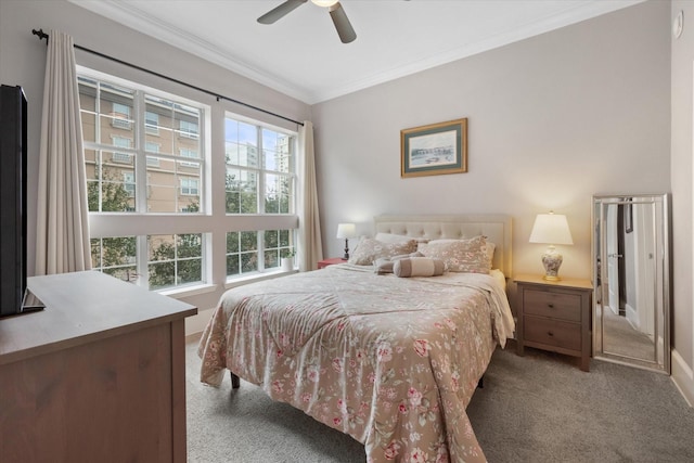 carpeted bedroom featuring ceiling fan and ornamental molding