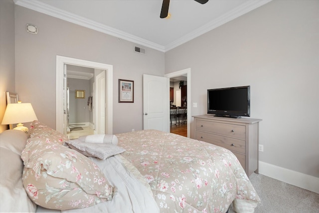 bedroom with ensuite bath, ornamental molding, and ceiling fan