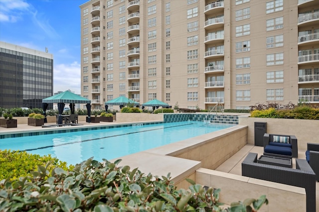 view of pool featuring a gazebo and a patio