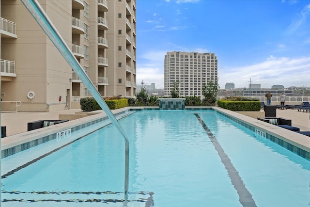 view of pool with pool water feature