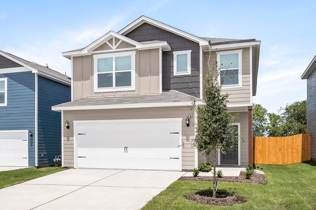 craftsman-style house with a garage and a front yard