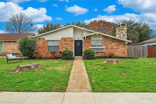 ranch-style home with a front yard