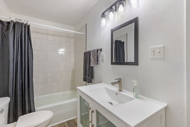 full bathroom featuring shower / bathtub combination with curtain, vanity, and toilet