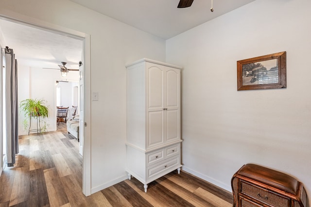 corridor with wood-type flooring