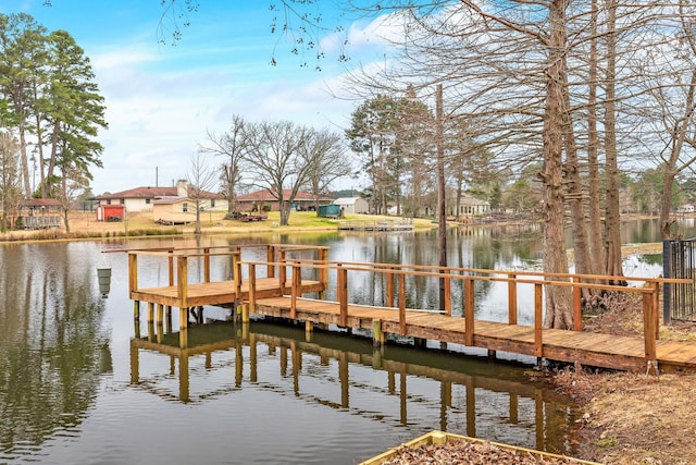 dock area with a water view