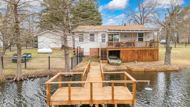 dock area featuring a deck with water view