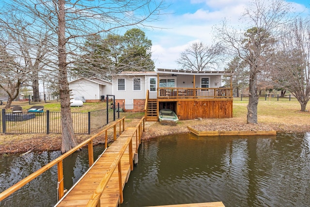 view of dock with a deck with water view