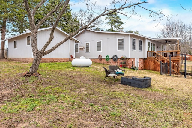 rear view of property featuring a lawn