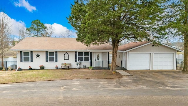 single story home featuring a garage and a front yard