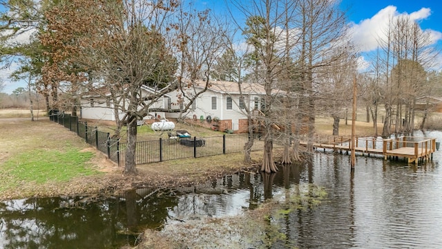 exterior space featuring a water view and a yard