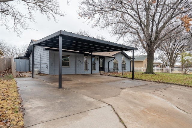 exterior space featuring a carport