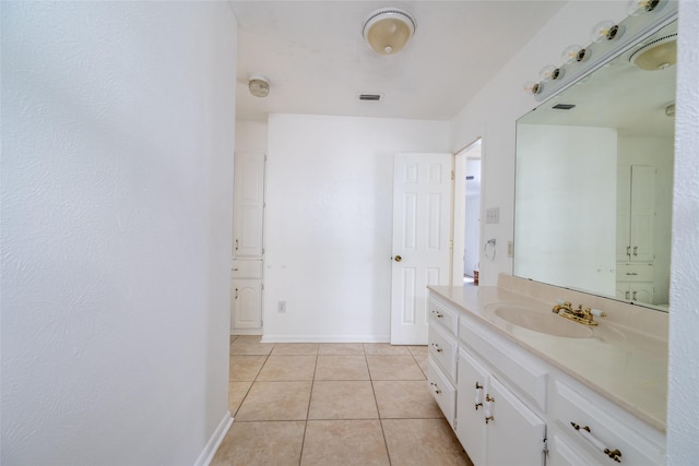 bathroom featuring tile patterned flooring and vanity