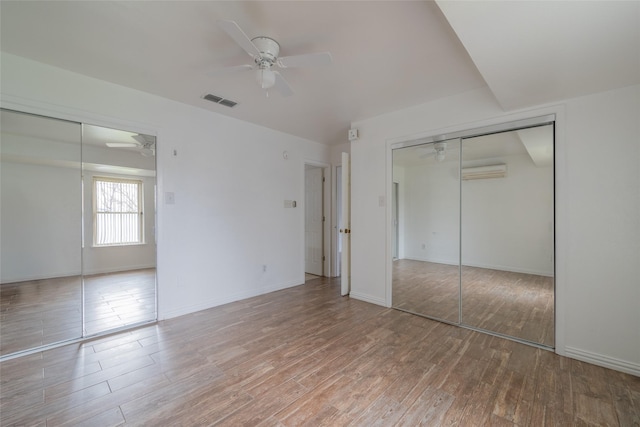 unfurnished bedroom with wood-type flooring and ceiling fan