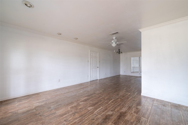 spare room featuring ornamental molding, dark hardwood / wood-style floors, and ceiling fan