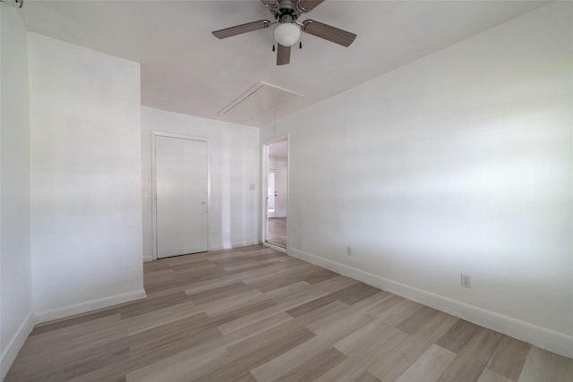 spare room with ceiling fan and light hardwood / wood-style flooring