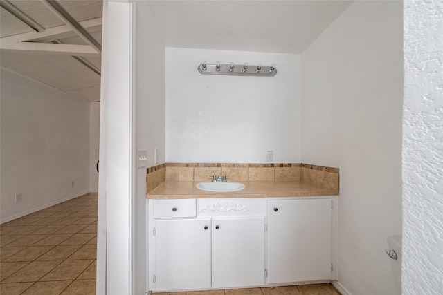 bathroom with vanity and tile patterned flooring