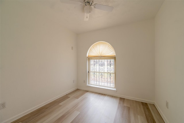 empty room featuring ceiling fan and light wood-type flooring