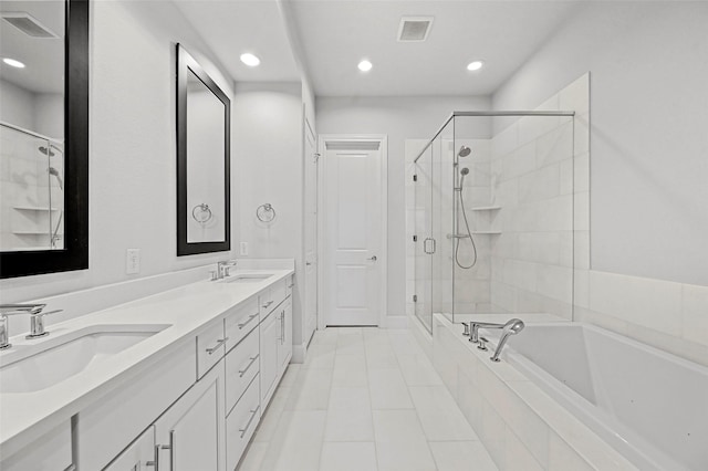 bathroom featuring vanity and separate shower and tub