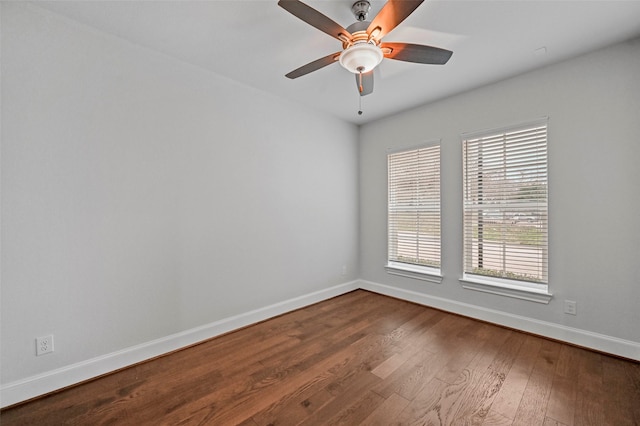 spare room with wood-type flooring and ceiling fan