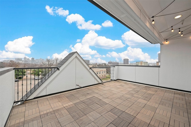 view of patio featuring a balcony