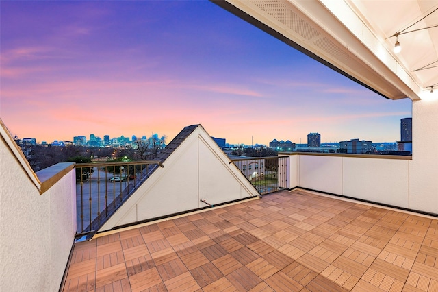 patio terrace at dusk with a balcony