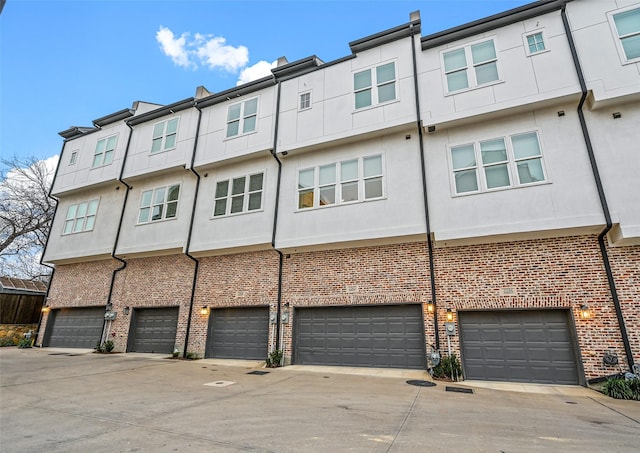 back of property with a garage