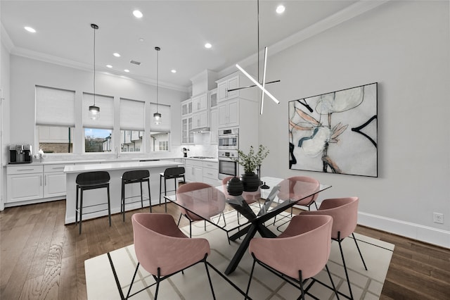 dining room featuring ornamental molding and dark hardwood / wood-style floors