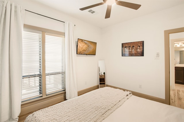 bedroom with connected bathroom and ceiling fan