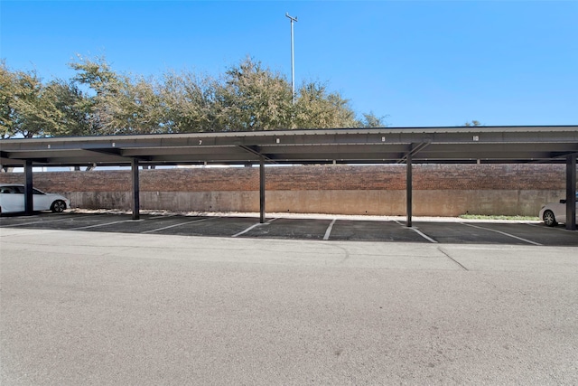 view of vehicle parking with a carport