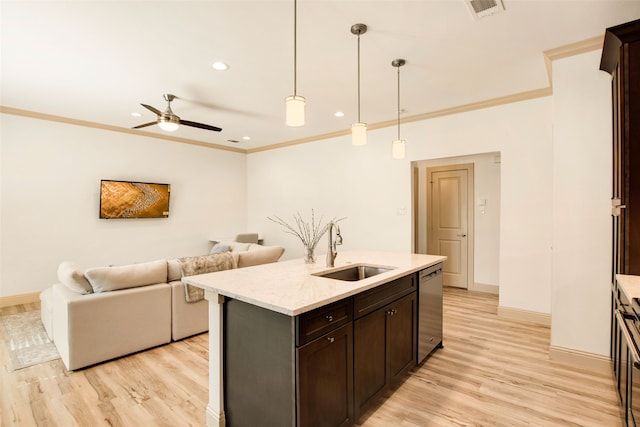 kitchen featuring sink, dark brown cabinets, stainless steel dishwasher, pendant lighting, and a kitchen island with sink