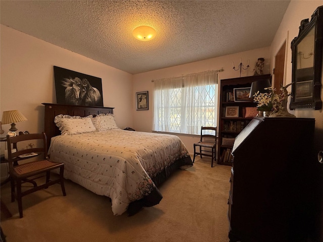 bedroom featuring light colored carpet and a textured ceiling