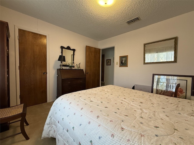 carpeted bedroom with a textured ceiling