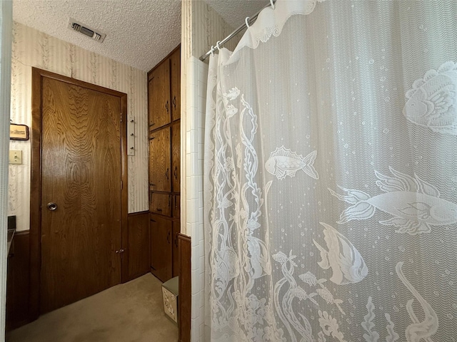 bathroom with a textured ceiling