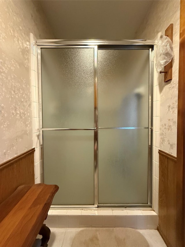 bathroom with a shower with shower door