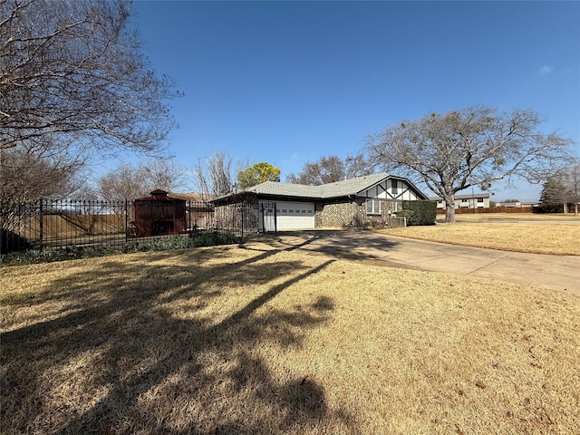 view of front of home featuring a garage and a front yard