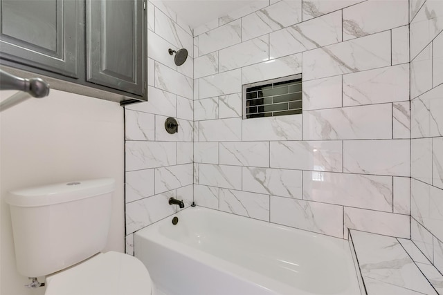 bathroom with toilet and tiled shower / bath combo