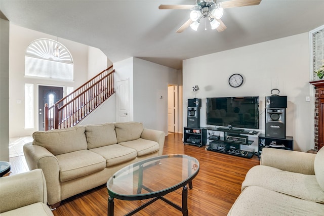 living room with hardwood / wood-style flooring and ceiling fan