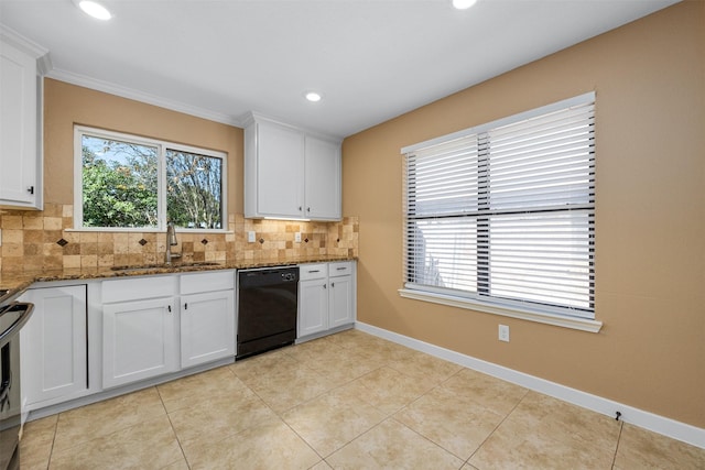 kitchen with white cabinetry, dark stone counters, and dishwasher