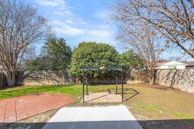 view of yard with a pergola and a patio