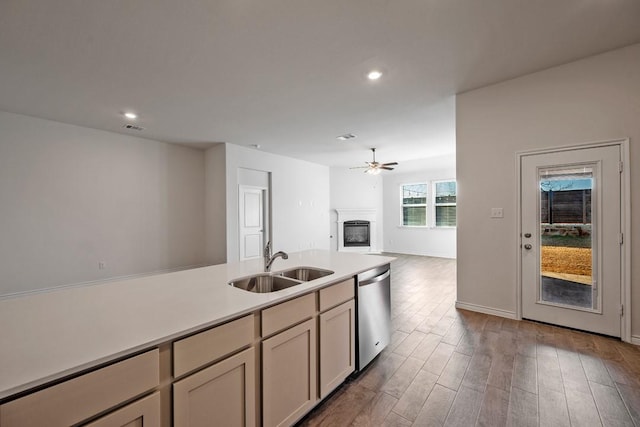 kitchen featuring dishwasher, sink, hardwood / wood-style floors, and ceiling fan