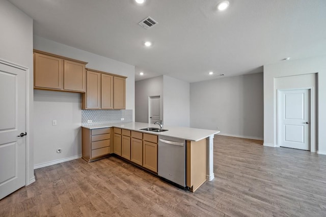 kitchen with light hardwood / wood-style flooring, stainless steel dishwasher, kitchen peninsula, and light brown cabinets