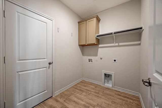 washroom with gas dryer hookup, electric dryer hookup, hookup for a washing machine, cabinets, and light wood-type flooring